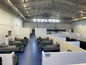 gymnasium converted to dorm-style shelter